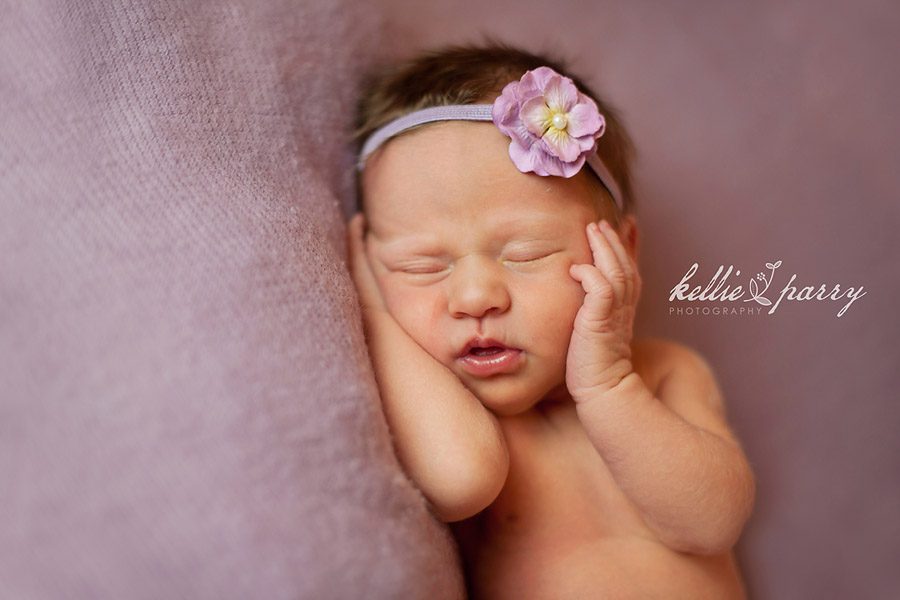 Newborn Hands on Face