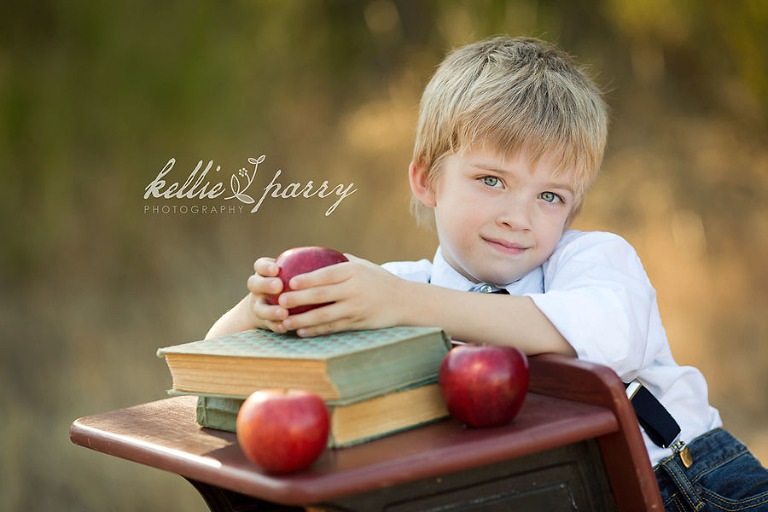 boy with books and apples