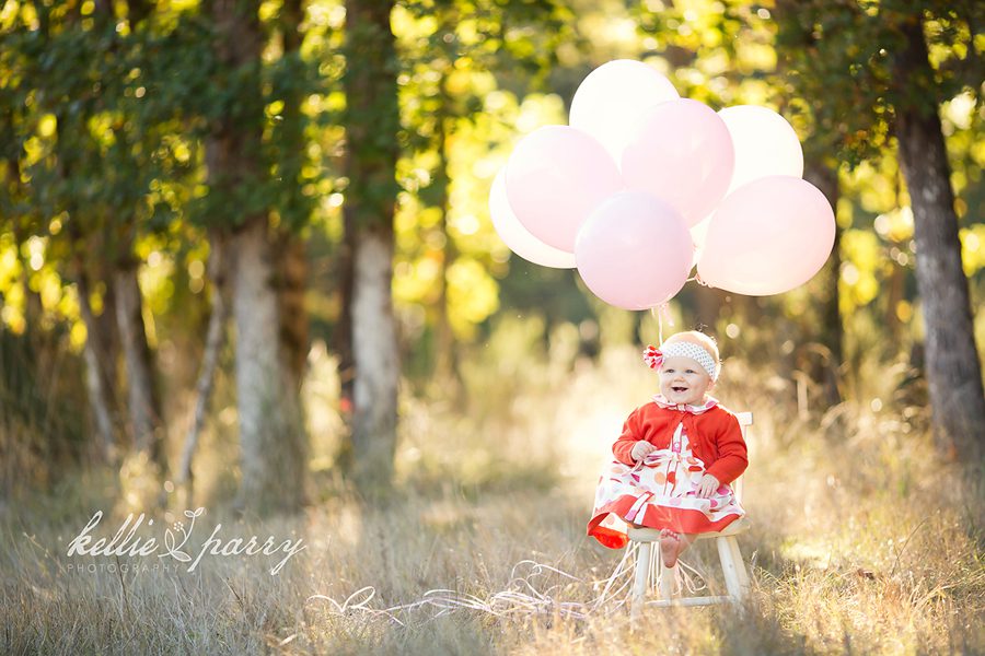 baby with balloons