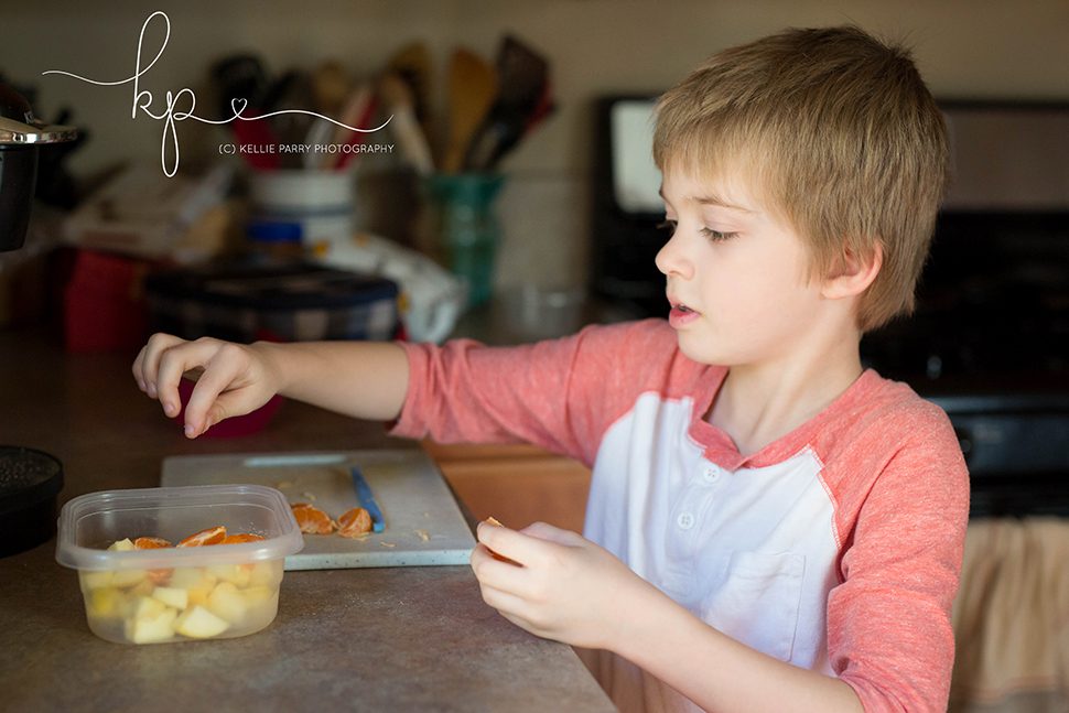 boy making a fruit salad