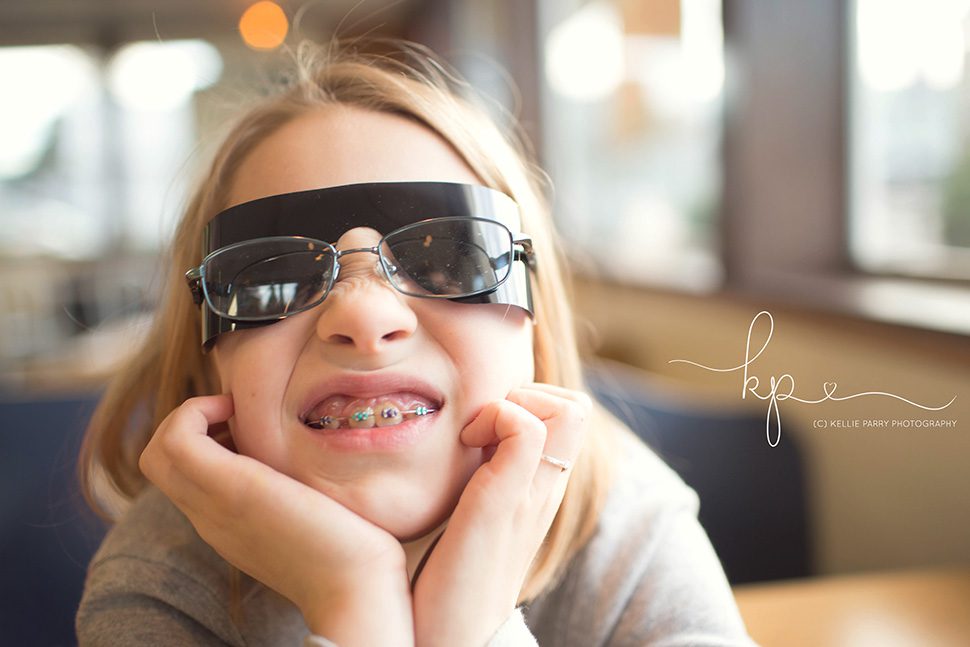 girl wearing sunglasses from eye doctor