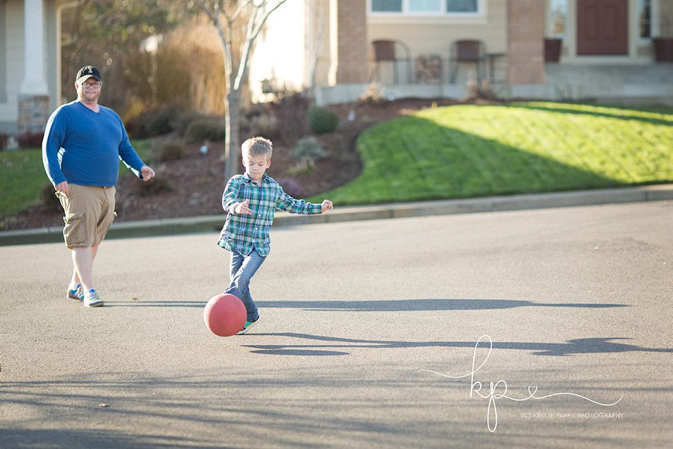 playing kick ball in street