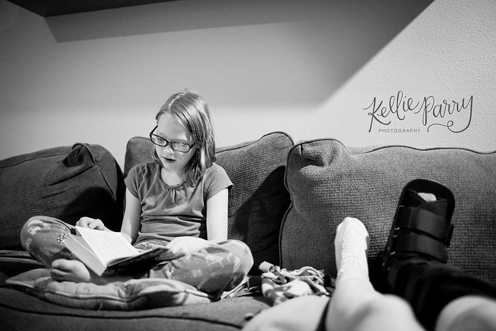 girl reading on couch
