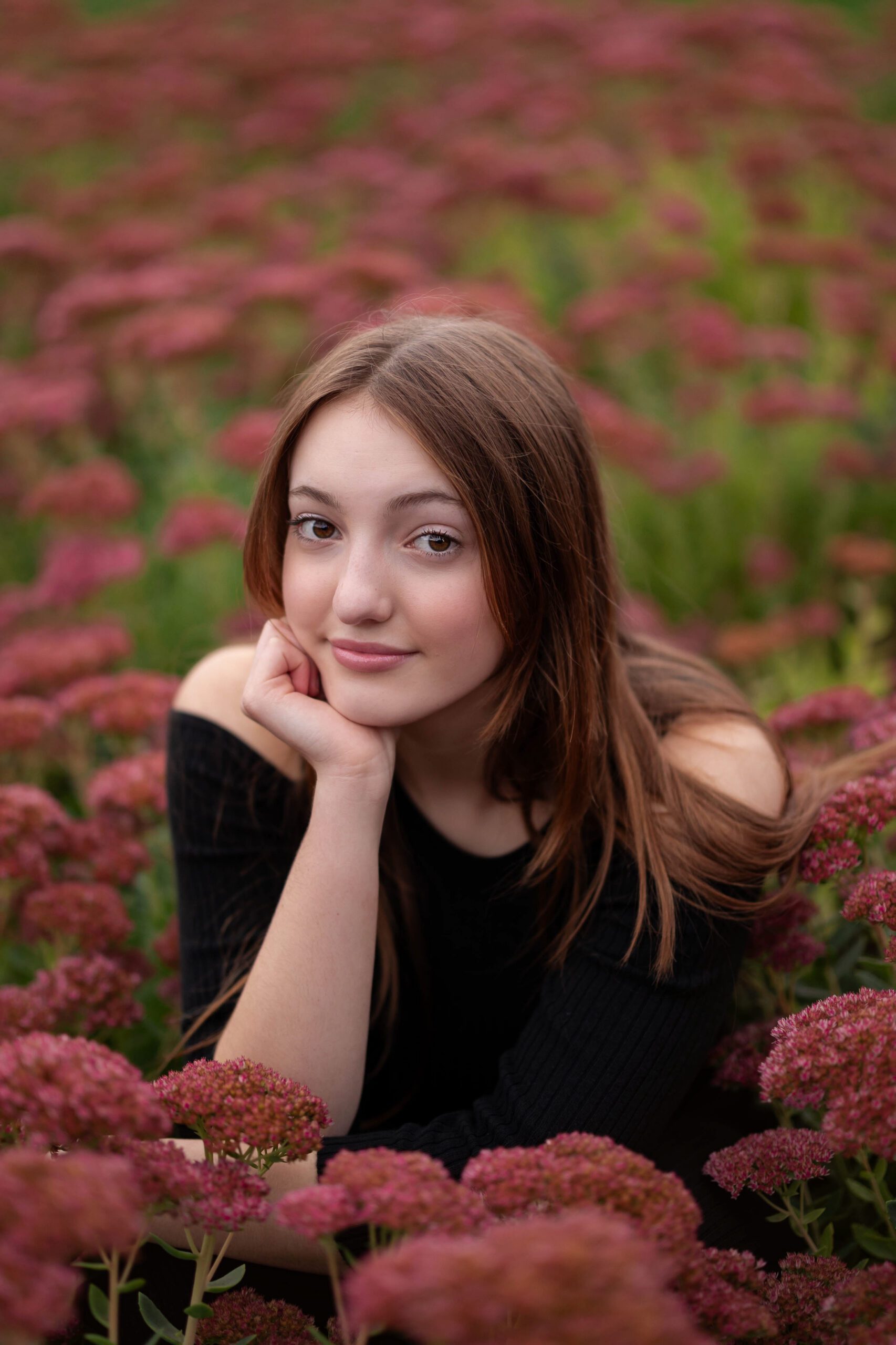 senior portrait of a girl in a field of flowers in Oregon